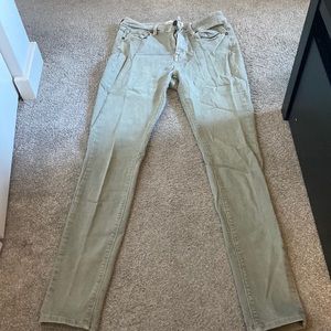 Faded green high rise skinny jeans. Size 7